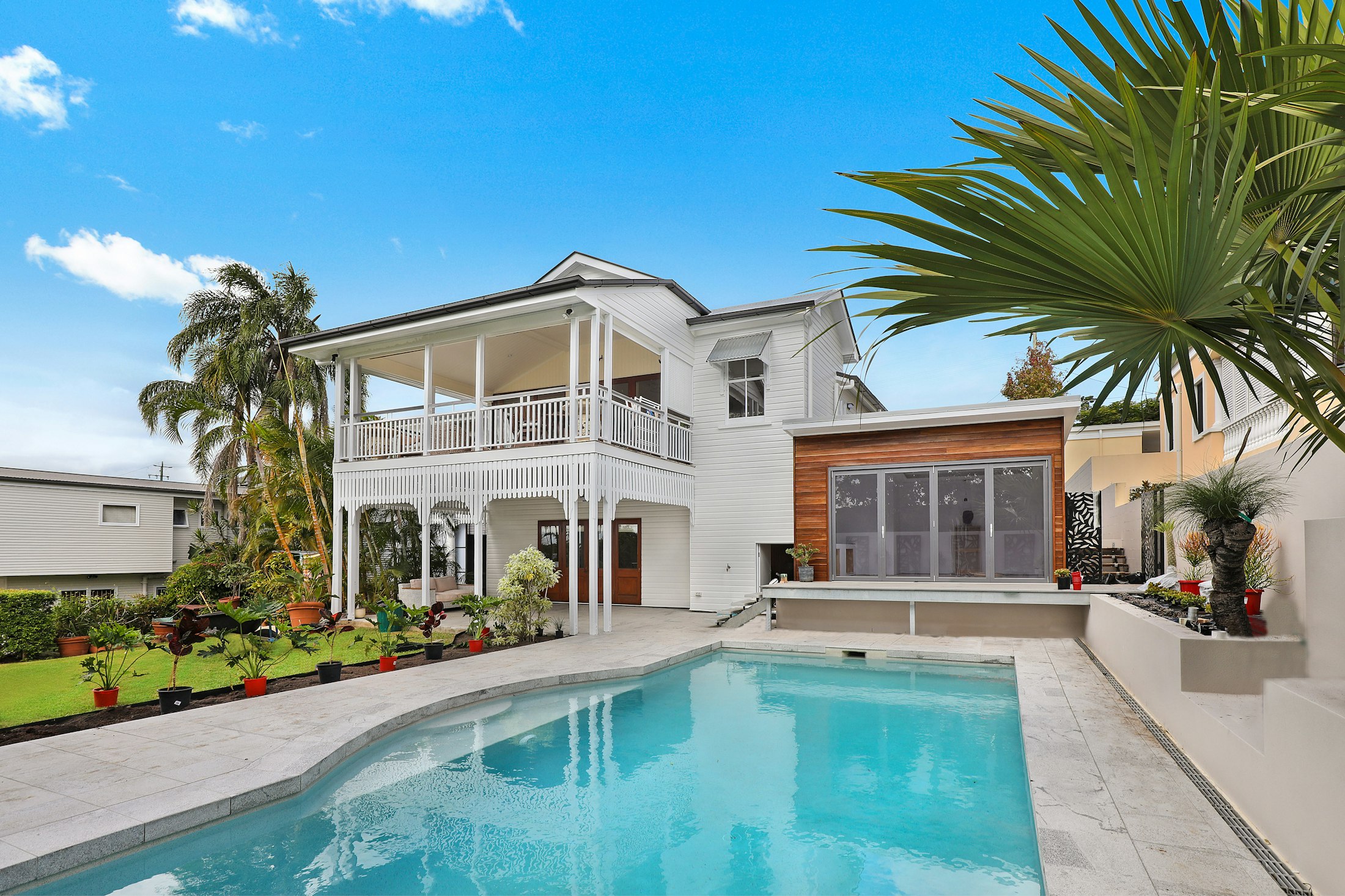 South Florida residence with a pool and palms
