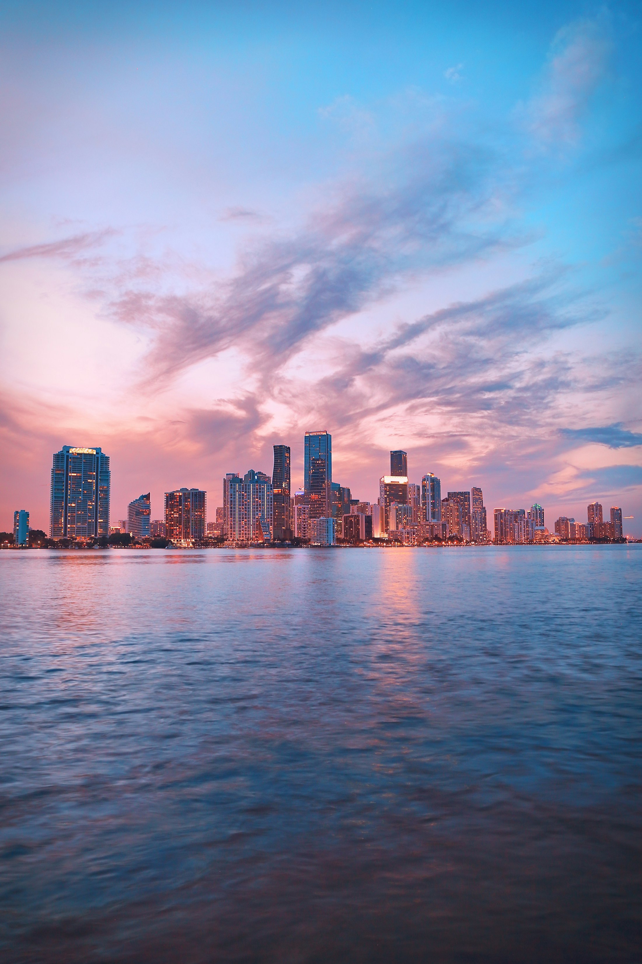Miami skyline across Biscayne Bay at dusk